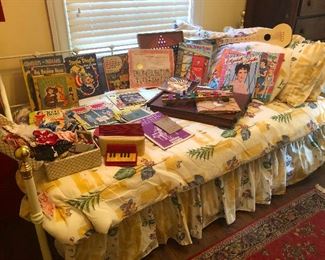 Flouncy day bed has been attacked by flock of antique children's books