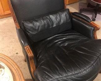 Nicely aged leather armchair has had some work done on its forehead