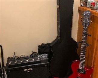 Electric guitar being followed by dark shadow