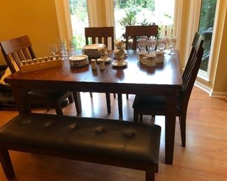 gorgeous dining room with four chair and bench