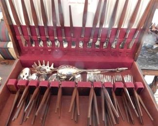 Set of stainless flatware with wooden handles