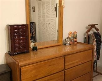 Vintage bedroom group—chest, dresser with mirror and king sized bed.
