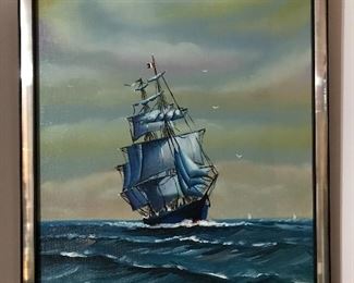 Framed paintings and prints with “ship at sea” theme.