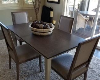 Crate and Barrel Dining table! Comes with 3 leaves that store underneath the table itself. 4 chairs