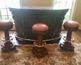 Marble top, kidney shape, brass accent bar with 3 weighted leather top swivel barstools