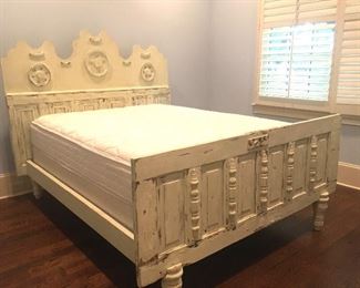 Old doors repurposed into a queen size bed