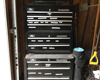 Husky Tool Chest(s) with a Craftsman placed up on top.
