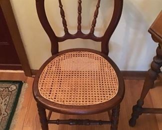 Antique hole caned side chair