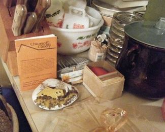 Red Wing , Tom and Jerry set. A viewer that has flower arrangements , Chicago Knife set , Sterling coasters .