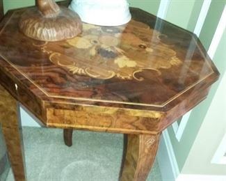 Yes, it's a gorgeous Italian Inlay Music Box Table (just lift the tabletop and "Love Story" fills the air with romance)