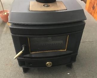 Brand new gas & wood stoves, many different models
