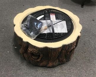 dozens of brand new outdoor fire pits of all shapes and sizes