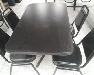Black Formica Top Table and Four Metal Vinyl Padded Chairs