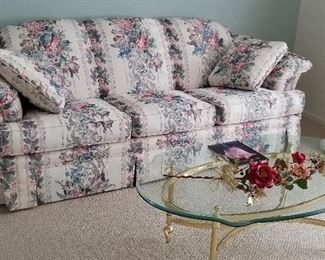 Another sofa for sale with a glass coffee table