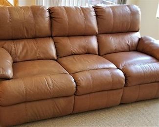 Leather sofa that has recliners