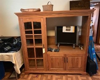 #27 oak tv cabinet w glass door and 2 wood oak doors and 35x32 tv opening $75.00
