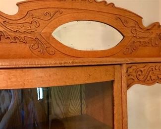 Beveled mirrors on oak secretary