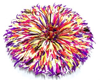 Feathered Ceremonial Bamileke dancing hat from Cameroon, also used as a decorative wall hanging accessory. Feathers in rich shades of magenta, purple, orange, and white tones. Woven grass base for structure, hats can be compressed and wrapped for storage. When opened, hat measures approx 32 inches in diameter by 6 inches in depth. When compressed, hat measures approx 18 inches diameter by 13.5 inches in depth. Property of a New York Private Collection. ‘The Juju Hat or as they are called in Cameroon the Bamileke or Tyn hats from the Bamileke tribes have come a long way from being traditional ceremonial headdress to adourning beautiful interior designer homes as contemporary wall hangings. For hundreds of years the Bamileke tribes have been creating these hats for their tribal chiefs, royal families and dignitaries.