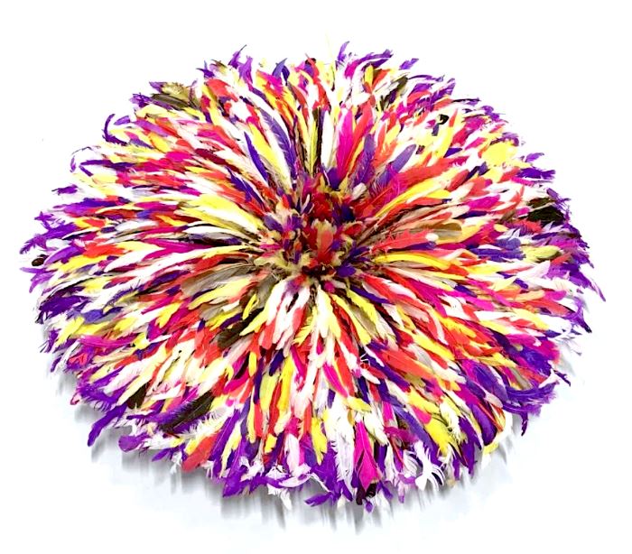 Feathered Ceremonial Bamileke dancing hat  from Cameroon, also used as a decorative wall  hanging accessory. Feathers in rich shades  of  magenta, purple, orange, and white tones.  Woven grass base for structure, hats can be compressed and wrapped for storage. When  opened, hat measures approx 32 inches in  diameter by 6 inches in depth. When  compressed, hat measures approx 18 inches  diameter by 13.5 inches in depth. Property of a New York Private Collection. ‘The Juju Hat or as they are called in  Cameroon the Bamileke or Tyn hats from the  Bamileke tribes have come a long way from  being traditional ceremonial headdress to adourning beautiful interior designer homes  as contemporary wall hangings. For hundreds of years the Bamileke tribes  have been creating these hats for their  tribal chiefs, royal families and dignitaries.
