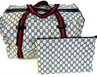 Genuine New In Box Gucci Boston Duffle,  Large, Navy Sherry Web Blue GG Supreme Canvas  Weekend/Travel Bag, Gold Toned tag on  interior reads Gucci Italy, serial number on  reverse of interior tag reads 012.904.0282, additional clutch bag with matching serial  number and blue leather tag that reads in  gold toned writing Gucci Made In Italy, bag  is new, taken out of packaging for  photographs. Duffel measures approximately 1 inches long x 11 inches tall x 12 inches  deep, clutch measures approximately 12 inches  long x 9 inches tall. No condition issues  noted.