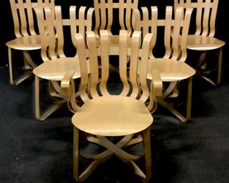 Set 6 FRANK GEHRY Hat Trick Chairs 1 Arm, 5  Side Chairs, Inspired by the apple crates he  had played on as a child, Pritzker  Prize-winning architect Frank Gehry created  the ribbon-like design of the Cross Check chair with interwoven maple strips. Each chair comes marked on underside with the  Knoll logo, Frank Gehry's signature and the  date of production and Made In USA, Arm chair  12/2/94, Side chairs 2/17/95. Measures approx armless: 20 inches w x 22.5 inches d x 33.5  inches h seat height 18 inches with arms: 23.4 inches w x 22.25 inches d x  33.5 inches h, seat height 18 inches, arm height 26 inches, light surface scratches on  seats.