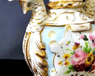 Antique French Porcelain, c. 1860. Vase with  Griffin handles. Hand-painted gilt and floral  decorations on a porcelain white ground with  pale blue tone details. Measures approx 6  inches in height by 4.5 inches in width by 2.75 inches in depth. Some very minor fading  of gilt details, consistent with age. Old  Paris porcelain, old French porcelain,  porcelain-ware, antique French porcelain,  ornate gilt vase, decorative display accessory, collectible Old Paris porcelain,  collectible French porcelain, griffin-form  handles, porcelain ceramic vase vessel, vieux  Paris porcelain, 19th century porcelain. 