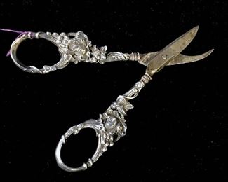 Antique grape shears, scissors with sterling  silver grape & leaf foliate pattern handles,  c. 1880. Marked for sterling along with faded  hallmark on interior of handle. Piece  measures  approx 6.2 inches in length by 2.25  inches in width. Some discoloration on  blades, might need polishing. Antique  sterling silver, grape shears, scissors,  collectible antique sterling silver, 19th  Century sterling silver. 