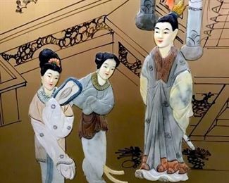 Vintage Oriental Four Panel Screen, Circular  in shape with hand painted and hand carved  Asian figurals in courtyard scene over black  and gold toned painted background, possibly  carved soapstone, three figural heads missing, damage to one pagoda arm, small  chips to painted finish on front, paint loss  to back panels, measures approximately 72  inches tall x 74 inches wide. Orientalism,  Chinoiserie, Orientalia, Room Divider, Asian Screen, Room Screen, Asian Themed Decor. 