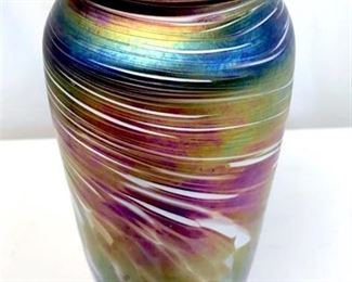 Signed on underside for Rosenbaum, 1993, New  Orleans. Studio art glass vase by Mark  Rosenbaum at NUANCE Glass Studio in  Louisiana. Rainbow Iridescent pattern.  Includes paper label for Nuance Studio. Measures approx 9 inches in height by 2.75  inches in diameter at opening. Decorative  display accessory, artisan glass vase,  vessel, collectible studio art glass, vintage  glass vase, iridescent rainbow pattern glass, interior home decor accessory. 