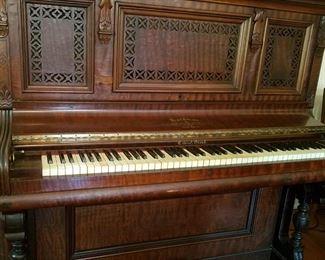 Gorgeous antique piano with fabulous wood carvings