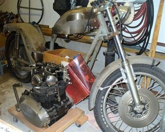 VINTAGE MOTORCYLE WITH LOTS OF PARTS IN THE GARAGE AND BASEMENT FOR RESTORATION.  OPEN TO GOOD OFFER