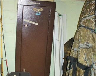 NICE GUN SAFE THAT HAS KEY.  MISCELLANEOUS FISHING GEAR AND A PORTION OF THE HUNTING ITEMS THAT FILL A WHOLE WALL.  SEE OTHER PICS