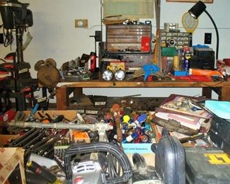 WE TOLD YOU THERE ARE A LOT OF TOOLS.  WALL TO WALL TABLES  FULL.  CHECK OUT THE ANTIQUE TOOL CHEST FULL OF ORIGINAL TOOLS.  OWNER WAS A TOOL AND DIE MAKER AND HE BOUGHT ONLY THE BEST.  ALSO NOTICE THE OLD GRINDING WHEEL  ON THE END OF THE WORK BENCH.  A REAL ESTATE SALE FIND AND IT WORKS