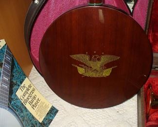 WE WERE TOLD THIS WAS CALLED A 4 STRING PLUNKER BANJO.  IN THE ORIGINAL CASE WITH MUSIC.  BEAUTIFUL CONDITION