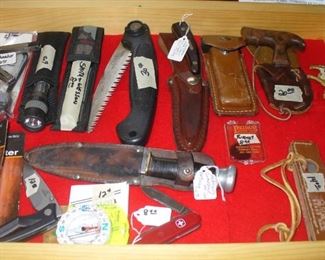 SOME OF THE VARIOUS KNIVES BEING OFFERED.  MORE HAVE BEEN ADDED SINCE THIS FIRST PHOTO WAS TAKEN.  WE EVEN FOUND A GREAT LEATHER MOLDED PIPE CASE.  