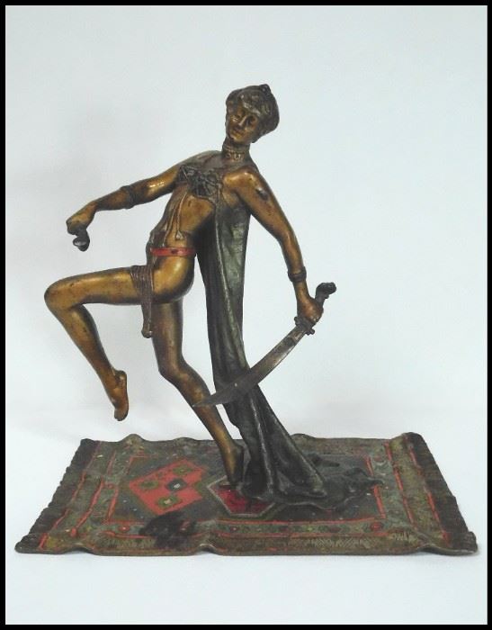 Art Nouveau Metal Sculpture of Woman with Sword on Persian Rug. Approximately 9" tall. 
