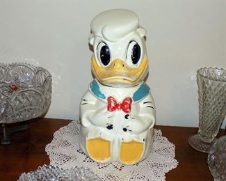 Disney Donald Duck Jose Carioca Turn About Cookie Jar. This 1940s Turn-About Cookie Jar is Walt Disney's Donald Duck & His Best Friend from Rio de Janeiro Jose, Joe, Carioca, who was part of the The Three Caballero's and Melody Time. Of all Turn-About Cookie Jars, this is the most sought after. Having been painted using Cold Paint over the top of paint and glaze method in the 40's and often washed away over the years due to having been washed with soaps and cleaners. . Bottom marked Donald Duck Joe Carioca Three Caballeros Walt Disney USA. 