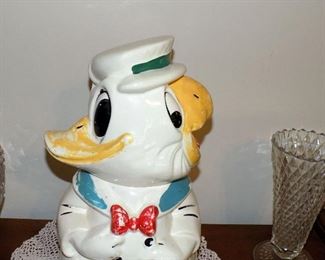 Disney Donald Duck Jose Carioca Turn About Cookie Jar. This 1940s Turn-About Cookie Jar is Walt Disney's Donald Duck & His Best Friend from Rio de Janeiro Jose, Joe, Carioca, who was part of the The Three Caballero's and Melody Time. Of all Turn-About Cookie Jars, this is the most sought after. Having been painted using Cold Paint over the top of paint and glaze method in the 40's and often washed away over the years due to having been washed with soaps and cleaners. . Bottom marked Donald Duck Joe Carioca Three Caballeros Walt Disney USA. 