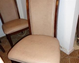 closeup of chairs that go with dining table