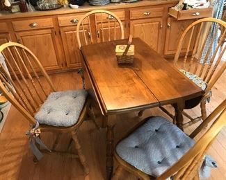 Drop leaf dinette with four chairs.