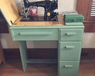 Sewing cabinet with Singer machine and accessories