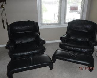 Pair of black leather recliners