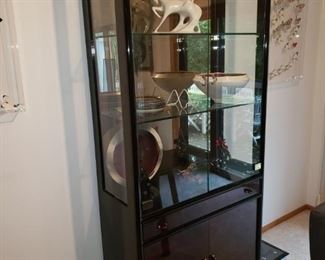 Herndon curio cabinet with built in silverware drawer.