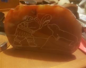 Genuine soap stone with etching of eskimo and seal