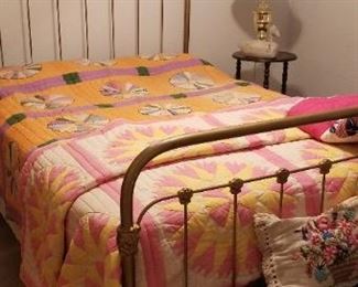 Vintage Brass bed with quilts