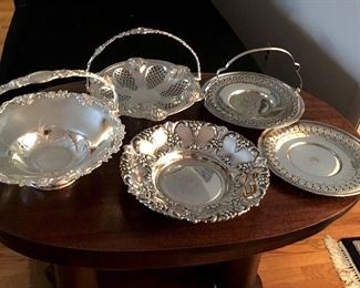 silver-plated cake baskets and serving dishes