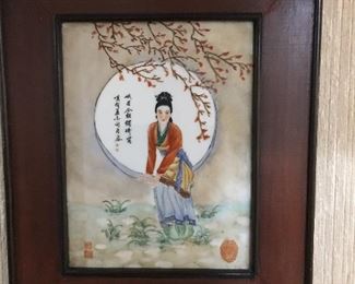 Early! Asian woman painted on tile and framed with a rich mahogany wood. Note the little Oriental style wall hanger atop the piece.