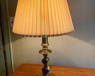 graceful pair of twisted brass lamps.