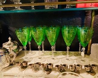 Finely etched 1930s green stems.