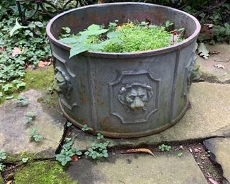 Vintage metal planter with lions.